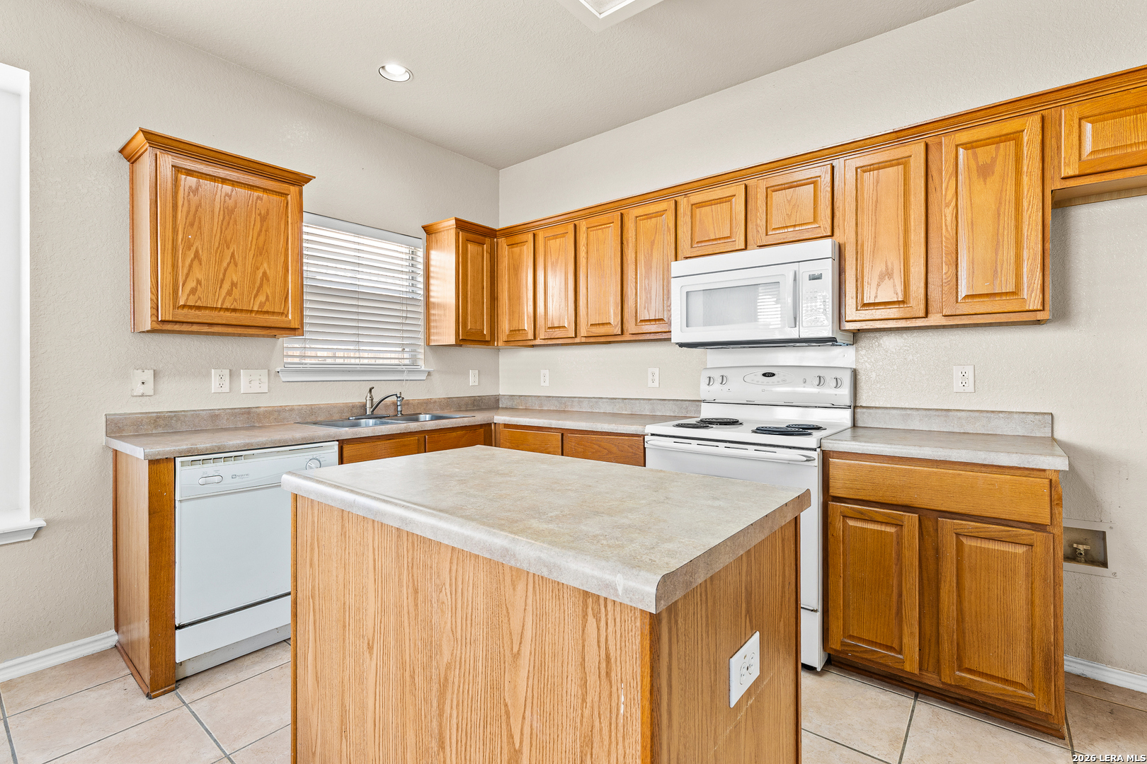 128 Pilot Cibolo, TX 78108 - Photo 17 of 49 a kitchen with stainless steel appliances granite countertop a sink stove and refrigerator