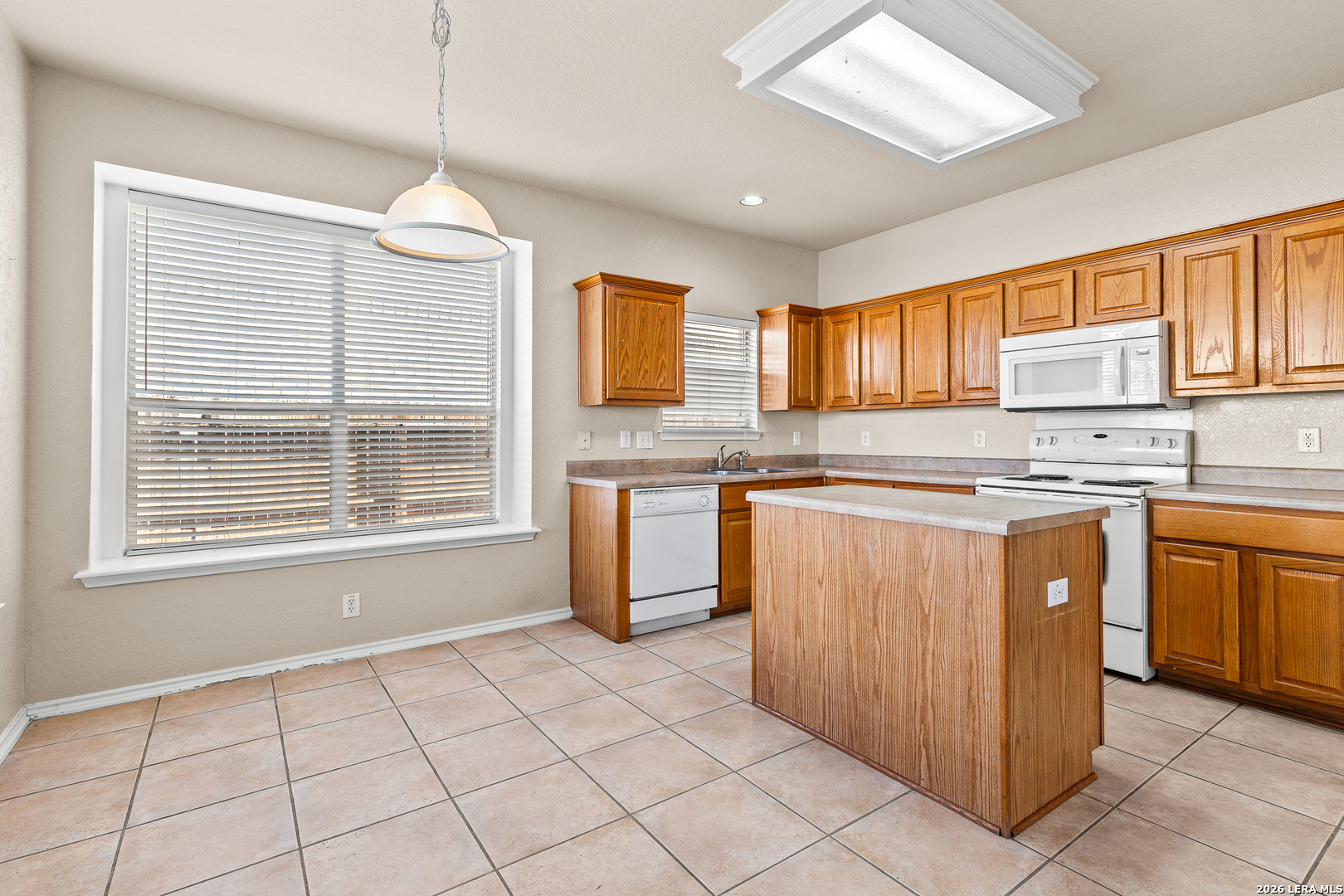 128 Pilot Cibolo, TX 78108 - Photo 20 of 49 a kitchen with stainless steel appliances granite countertop a stove sink and cabinets