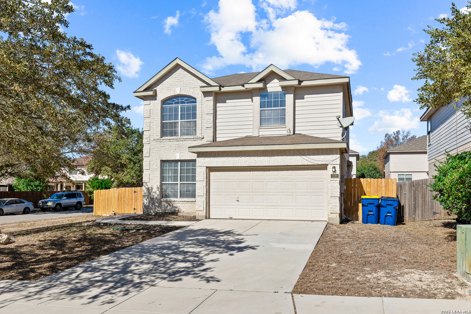 128 Pilot Cibolo, TX 78108 - Photo 2 of 49 a front view of a house with a yard and garage