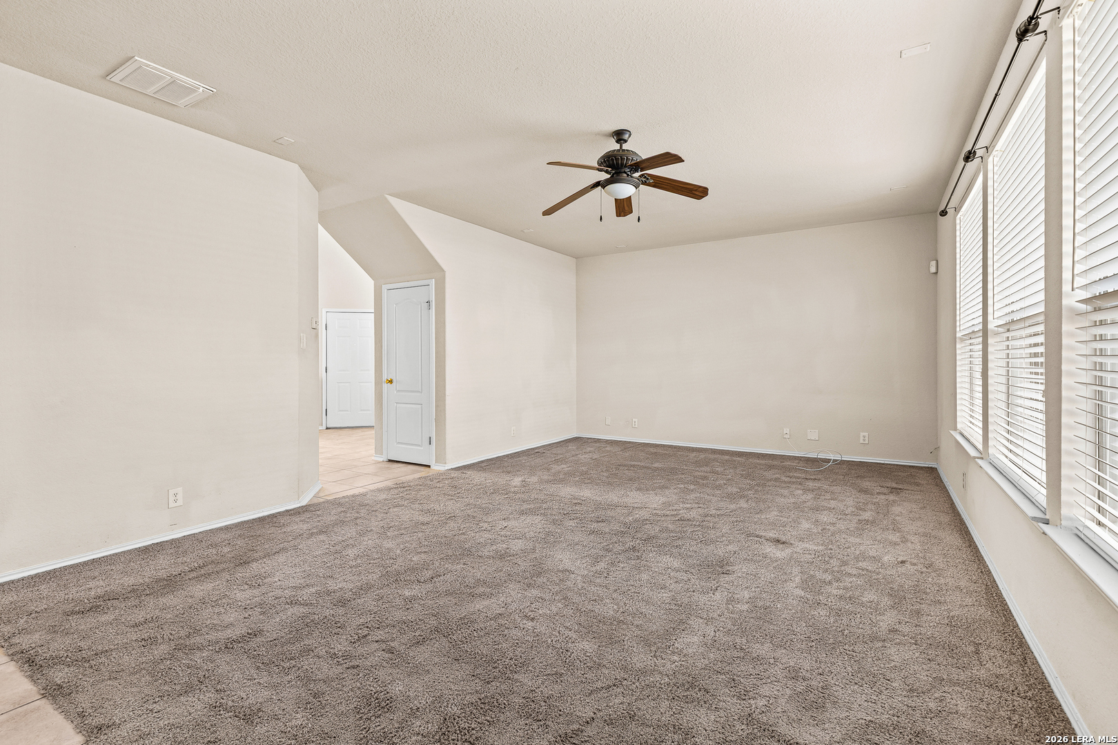 128 Pilot Cibolo, TX 78108 - Photo 22 of 49 a view of a livingroom with a ceiling fan and window