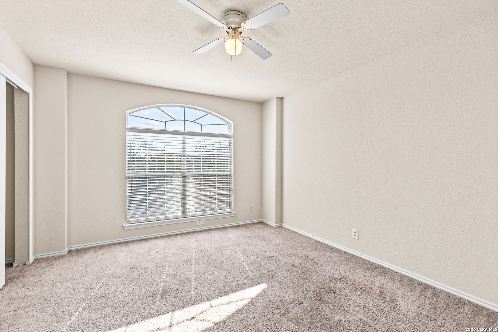 128 Pilot Cibolo, TX 78108 - Photo 30 of 49 an empty room with windows and ceiling fan