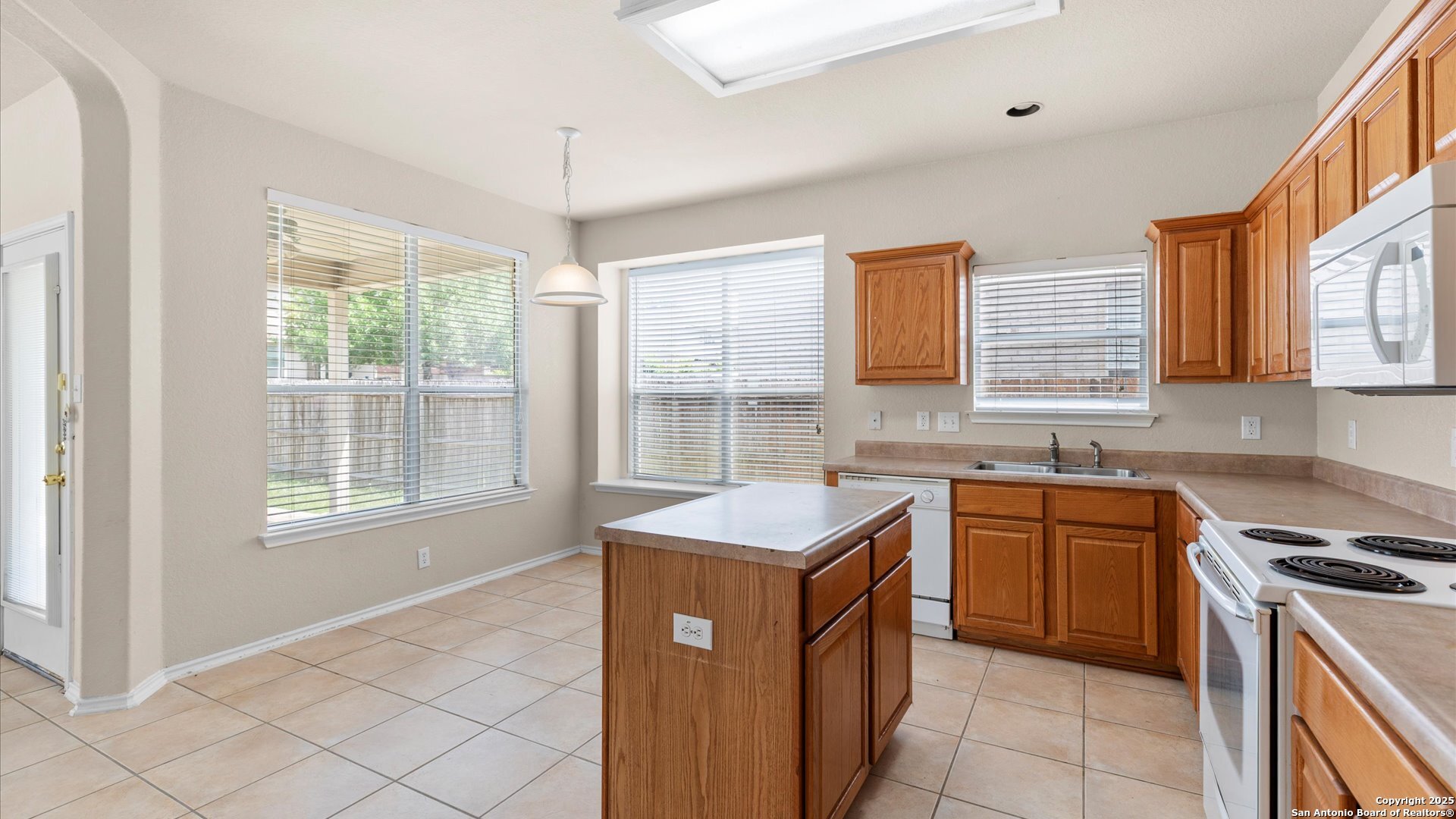 128 Pilot Cibolo, TX 78108 - Photo 3 of 22 a kitchen with stainless steel appliances granite countertop a sink stove and refrigerator