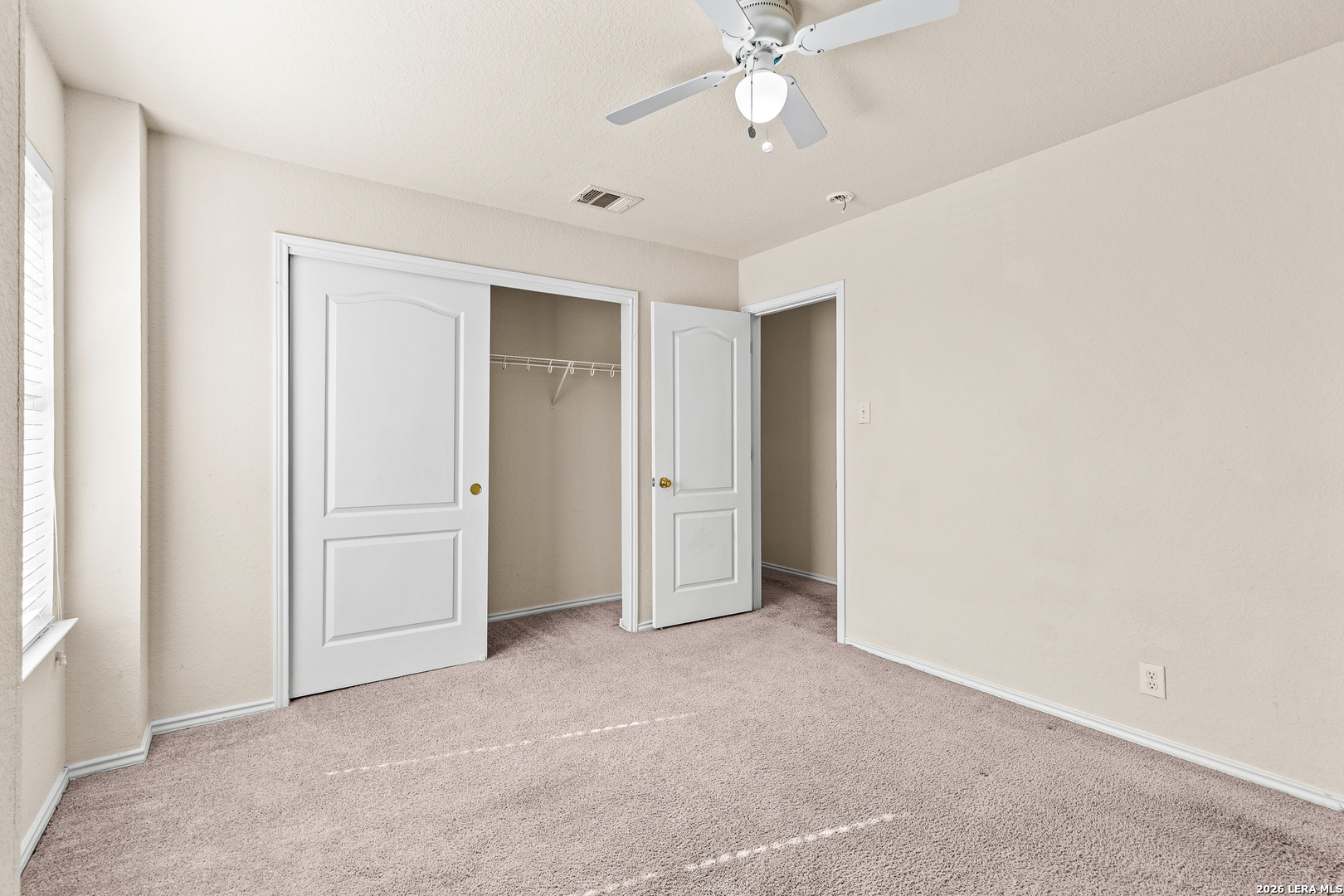 128 Pilot Cibolo, TX 78108 - Photo 33 of 49 an empty room with a ceiling fan and a window