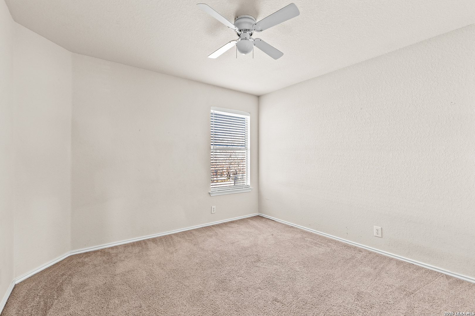 128 Pilot Cibolo, TX 78108 - Photo 36 of 49 an empty room with a chandelier fan and windows