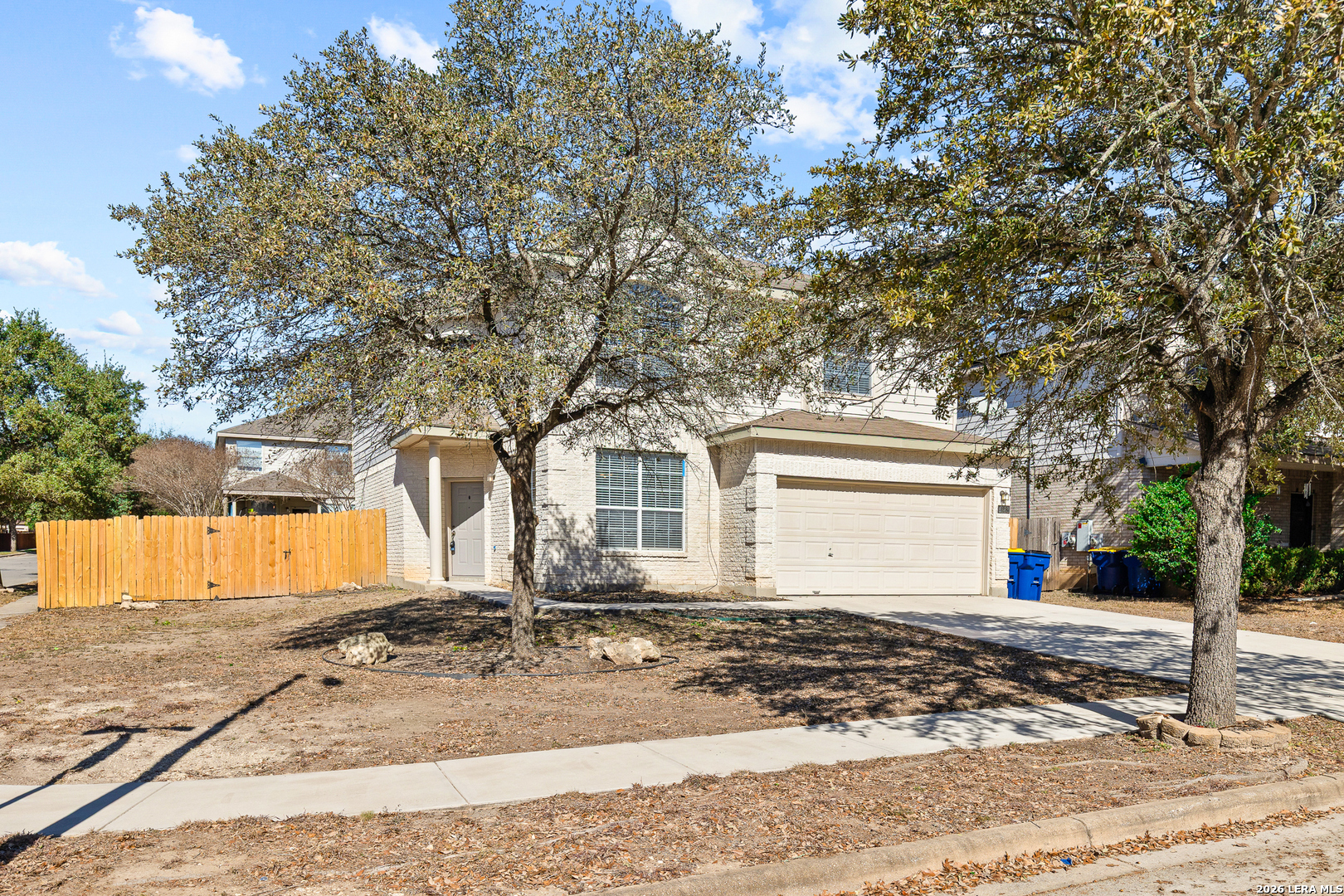 128 Pilot Cibolo, TX 78108 - Photo 4 of 49 a front view of a house with a yard and garage