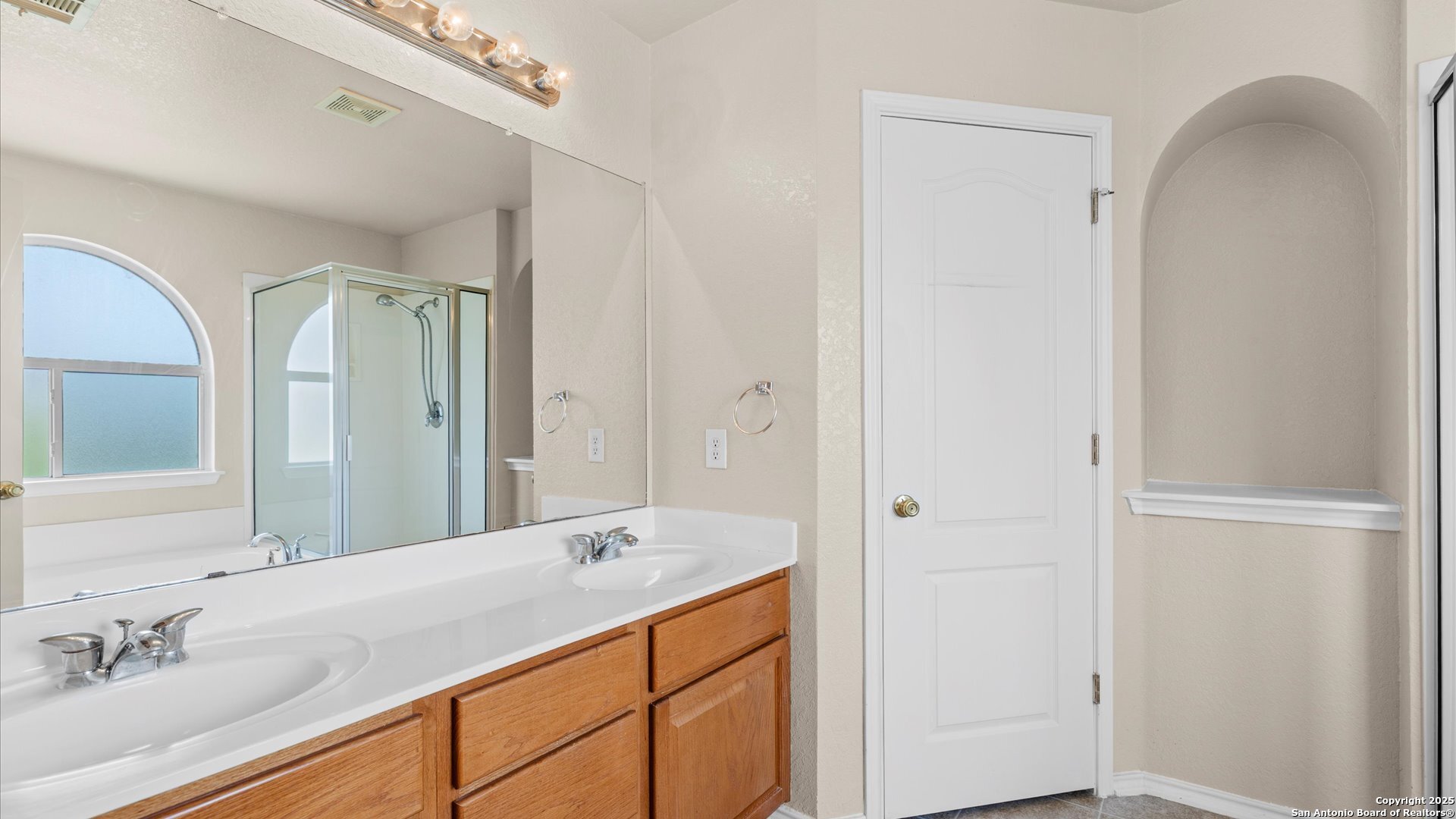 128 Pilot Cibolo, TX 78108 - Photo 9 of 22 a bathroom with a shower sink and mirror