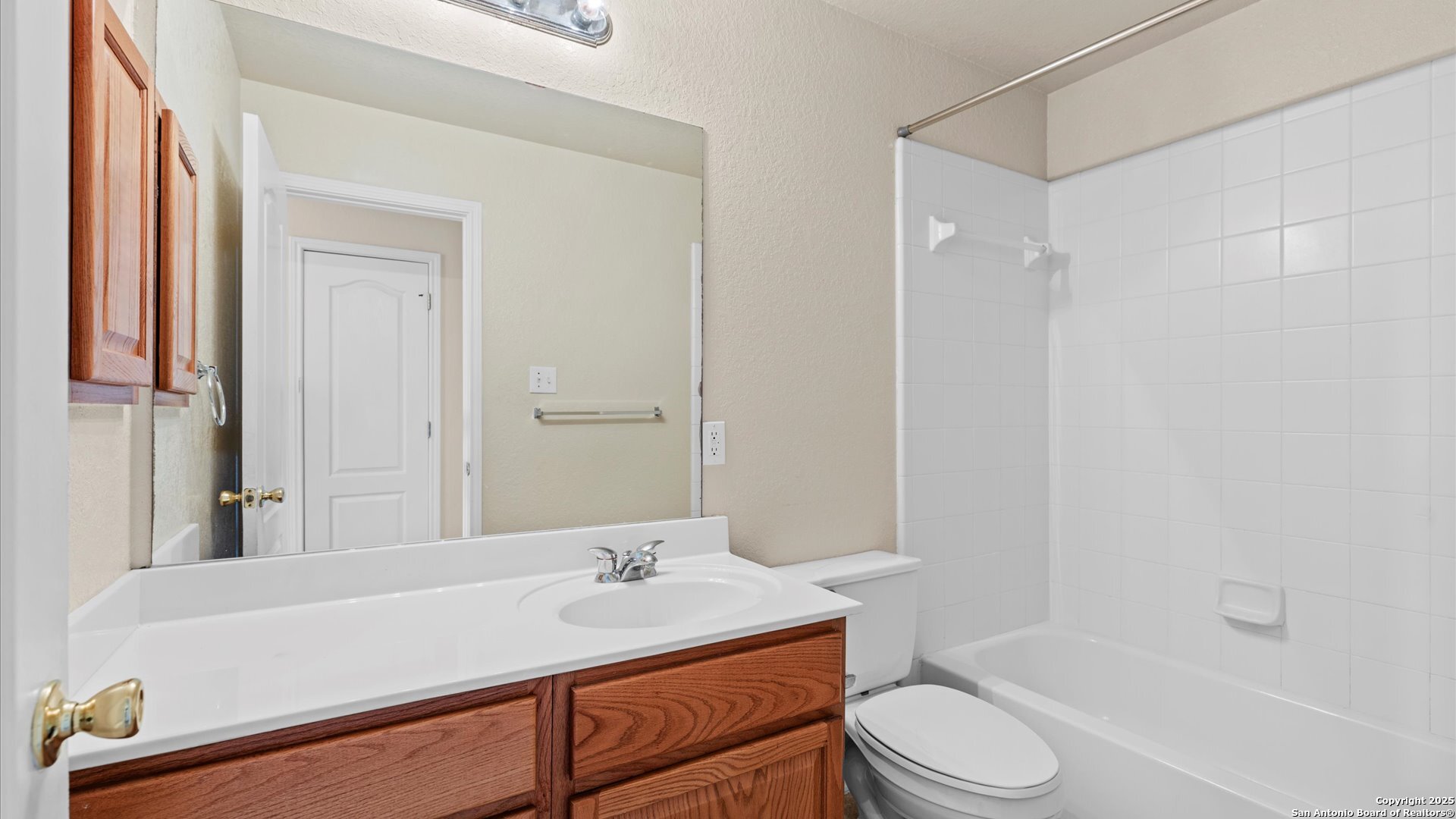 128 Pilot Cibolo, TX 78108 - Photo 10 of 22 a bathroom with a granite countertop sink toilet a mirror and shower
