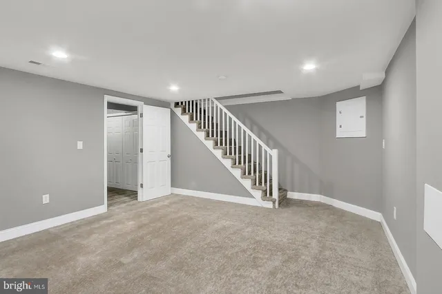 a view of an empty room with stairs