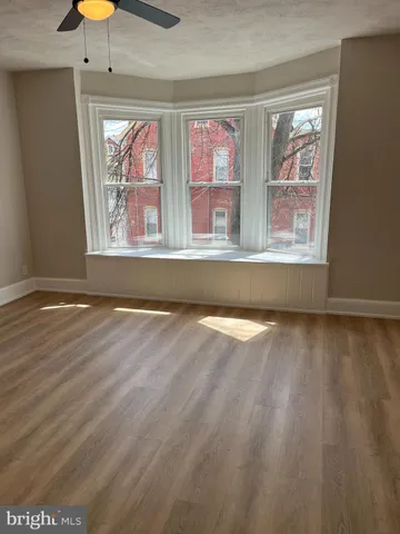 a view of lot of furniture and chandelier