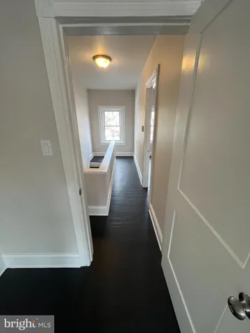 a view of a hallway view with staircase