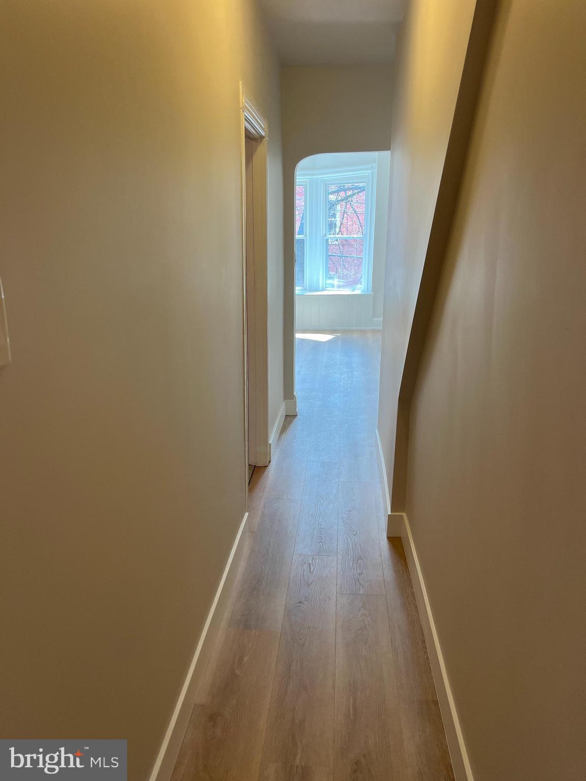 339 Chestnut Street, Unit 2 Pottstown, PA 19464 - Photo 7 of 19 a view of a hallway with wooden floor