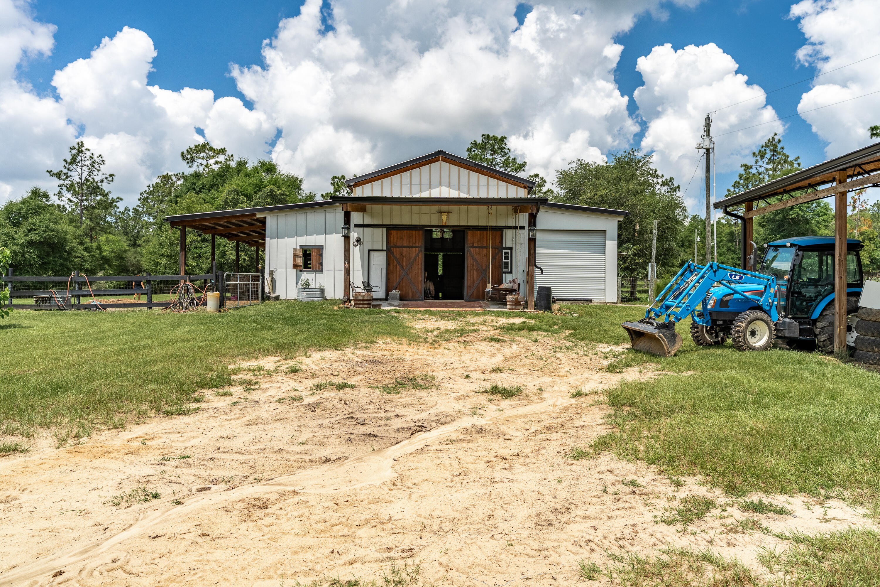 6263 Old River Road Baker, FL 32531 - Photo 11 of 69 a front view of a house with garden