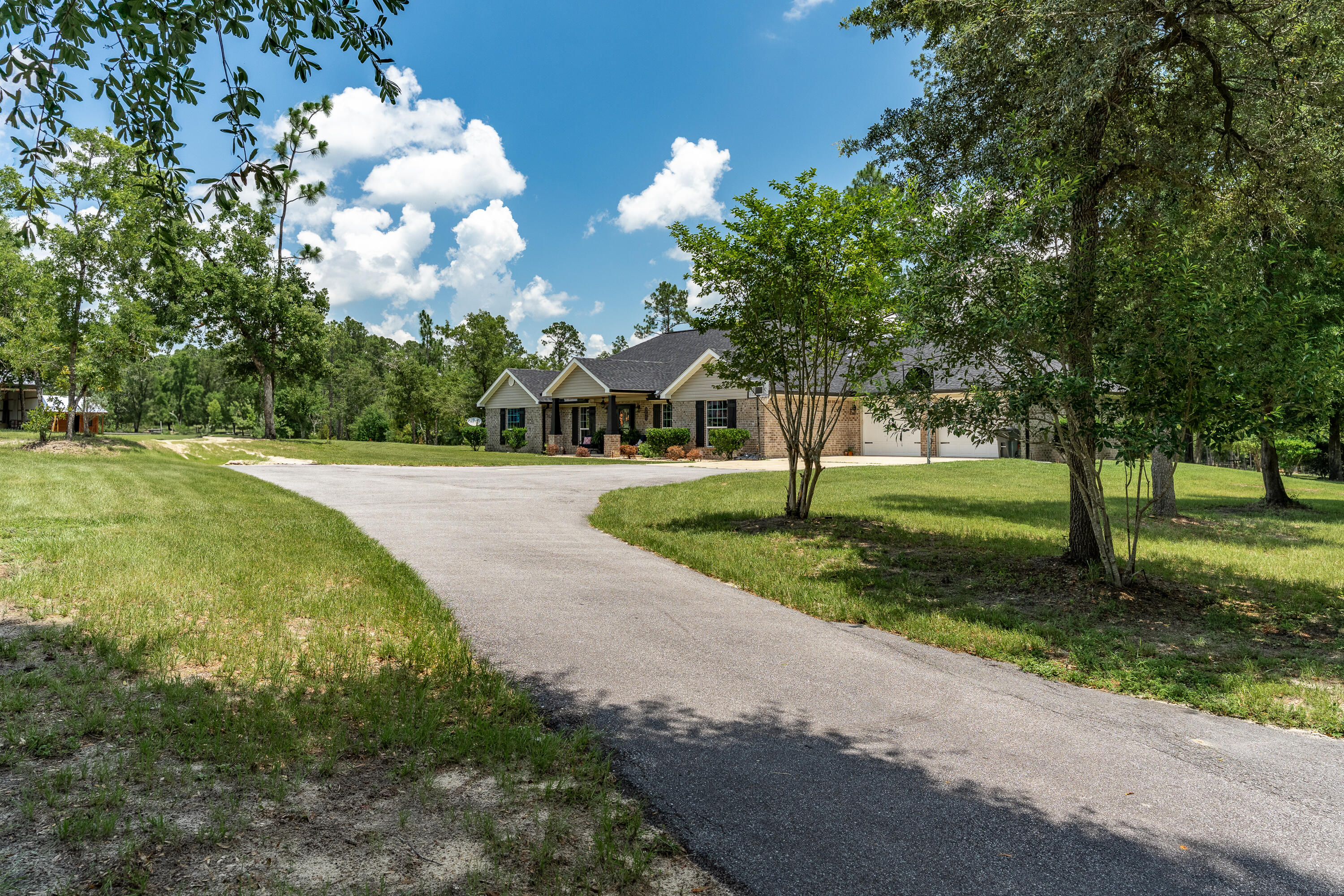 6263 Old River Road Baker, FL 32531 - Photo 16 of 69 a view of a playground with tree s