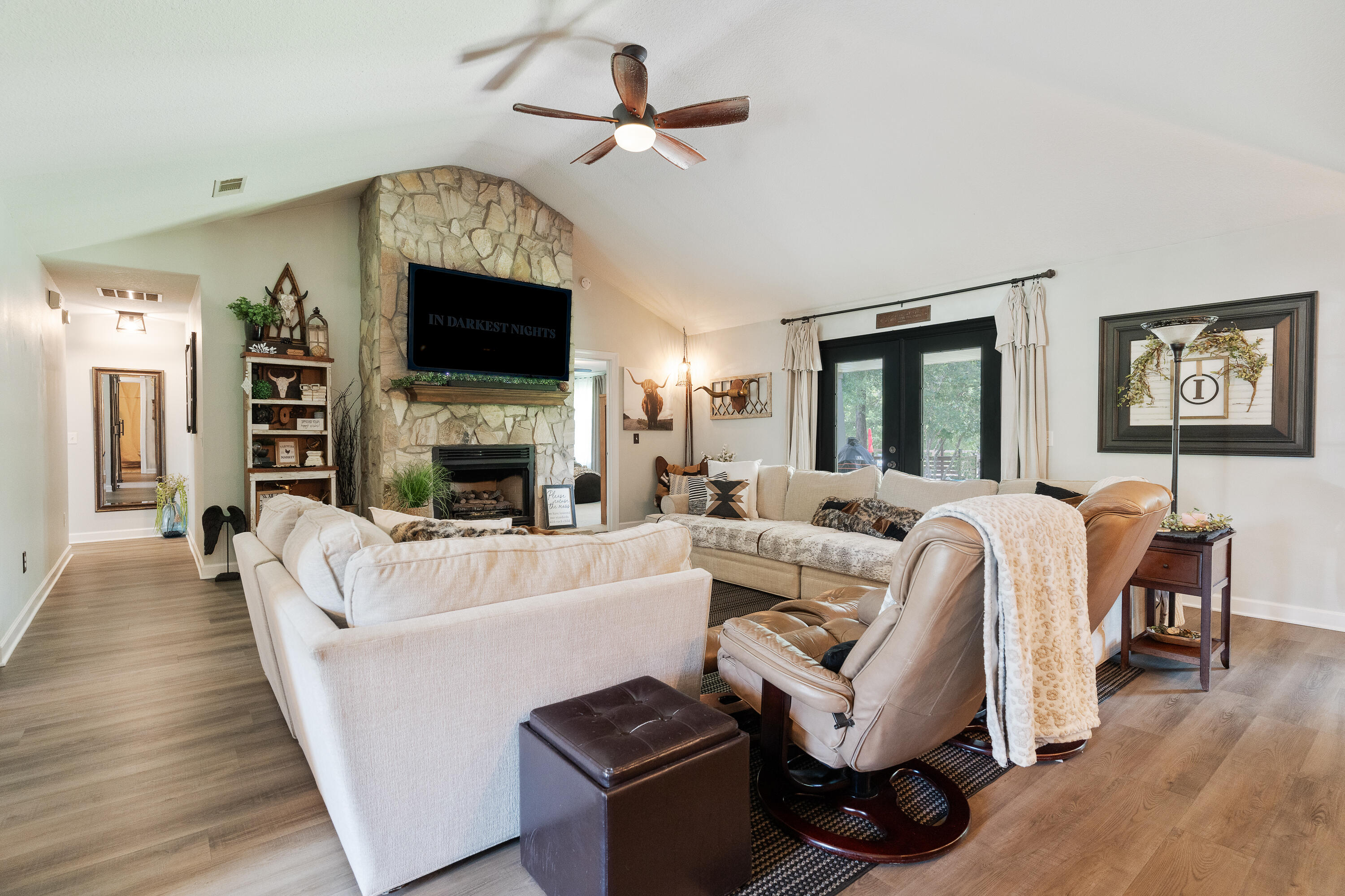 6263 Old River Road Baker, FL 32531 - Photo 27 of 69 a living room with furniture a fireplace and a flat screen tv