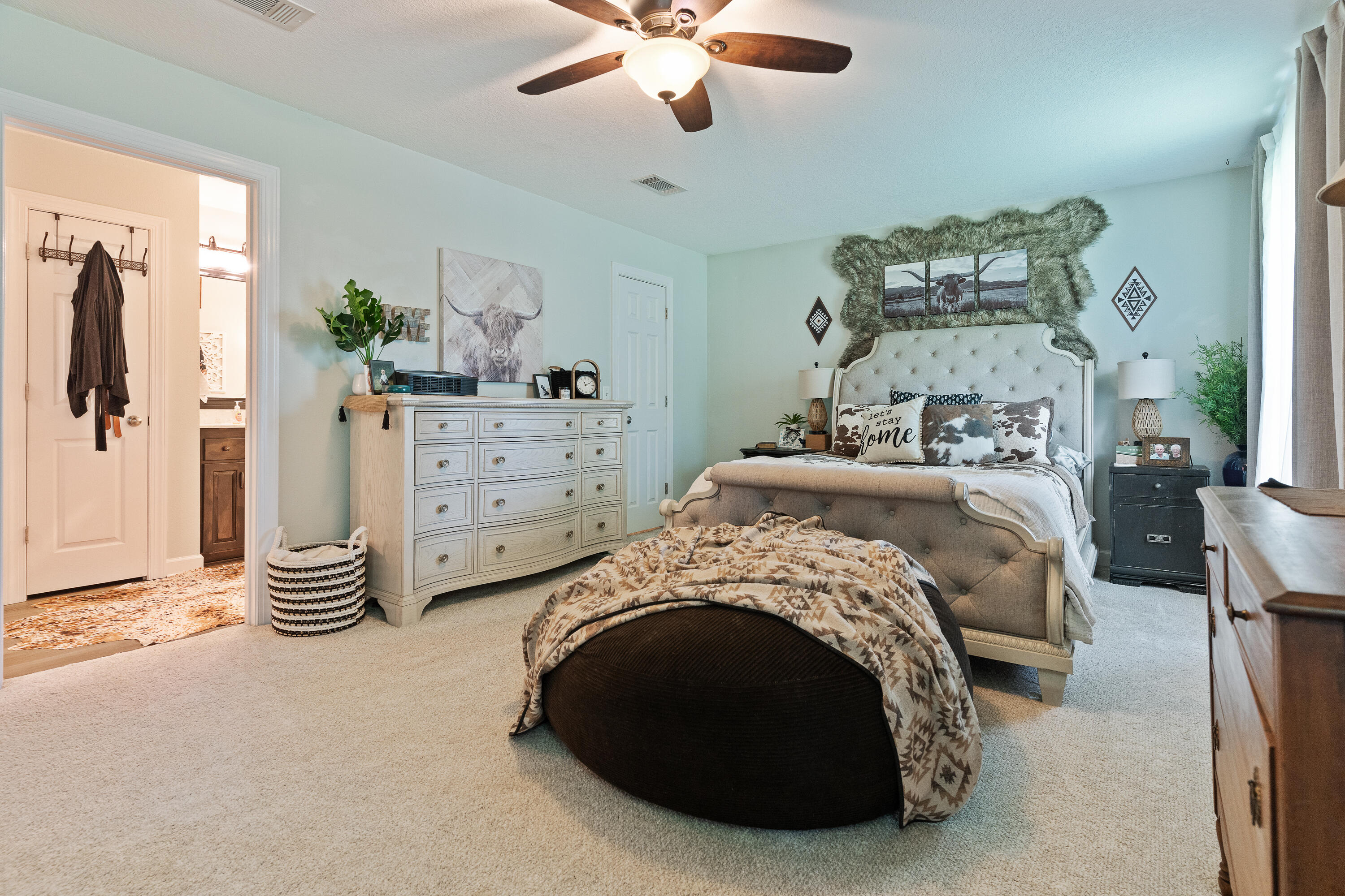 6263 Old River Road Baker, FL 32531 - Photo 44 of 69 a bedroom with a bed and a chandelier