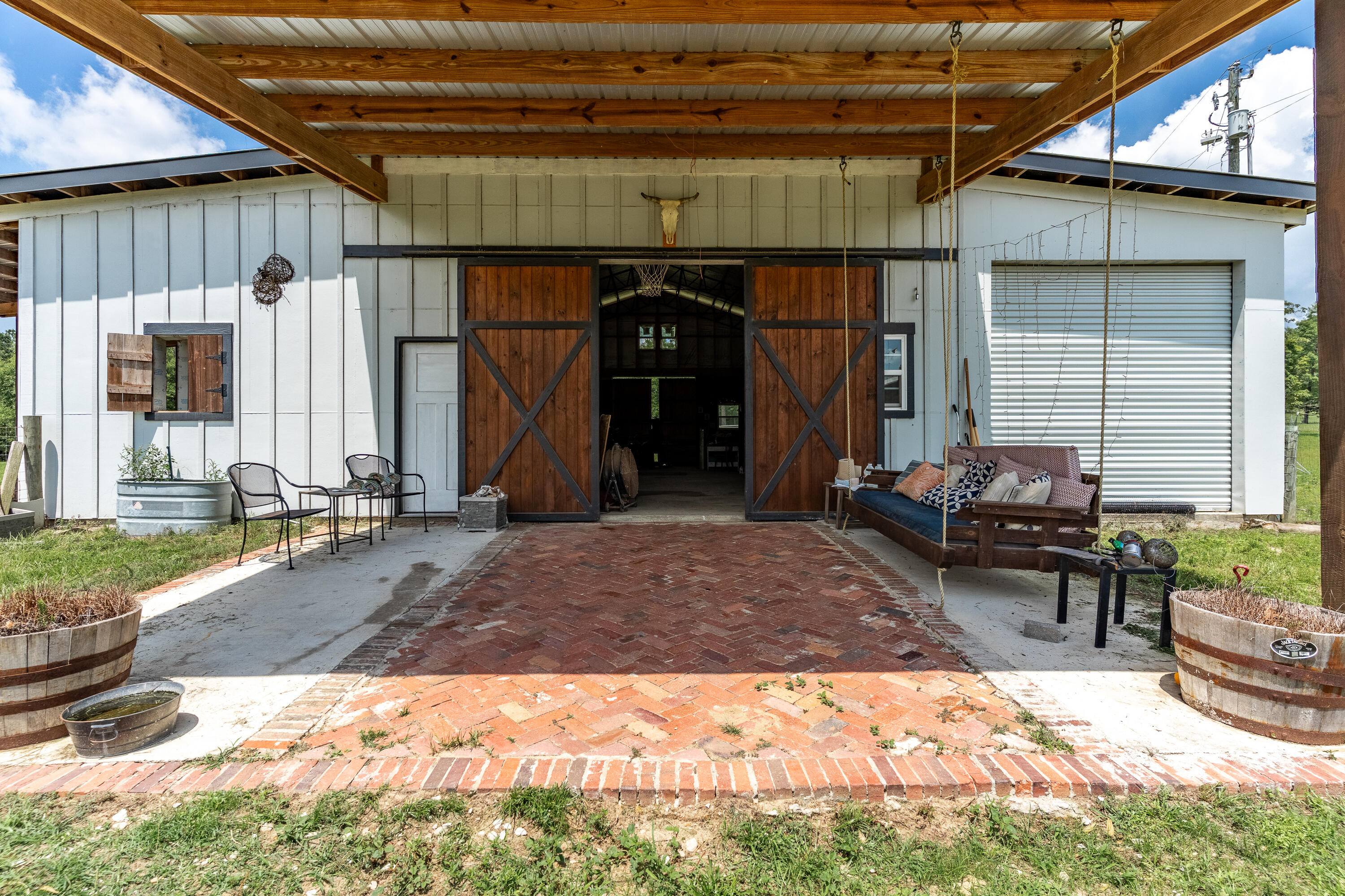 6263 Old River Road Baker, FL 32531 - Photo 5 of 69 a view of a chairs and table in the patio