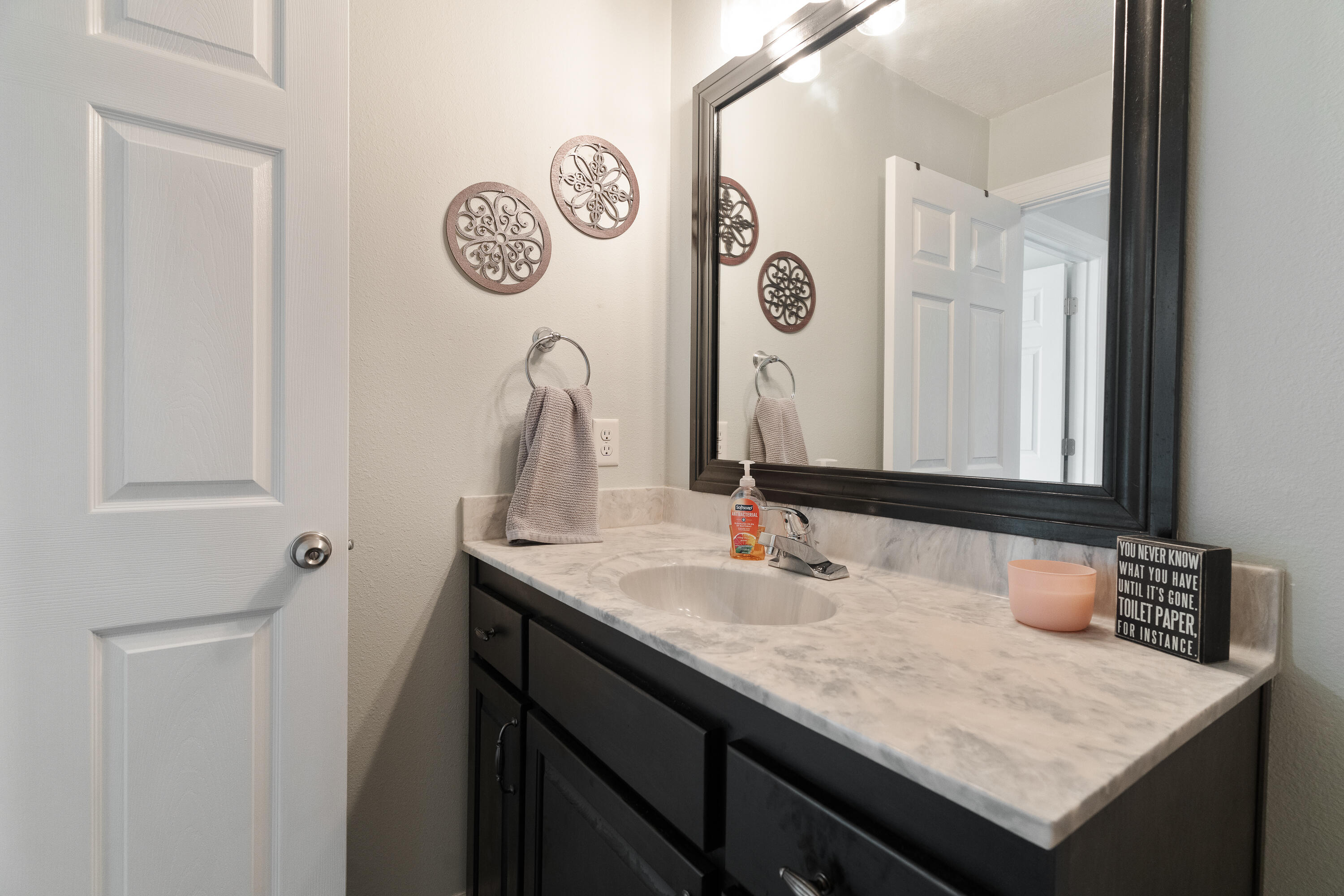 6263 Old River Road Baker, FL 32531 - Photo 53 of 69 a bathroom with a sink and a mirror