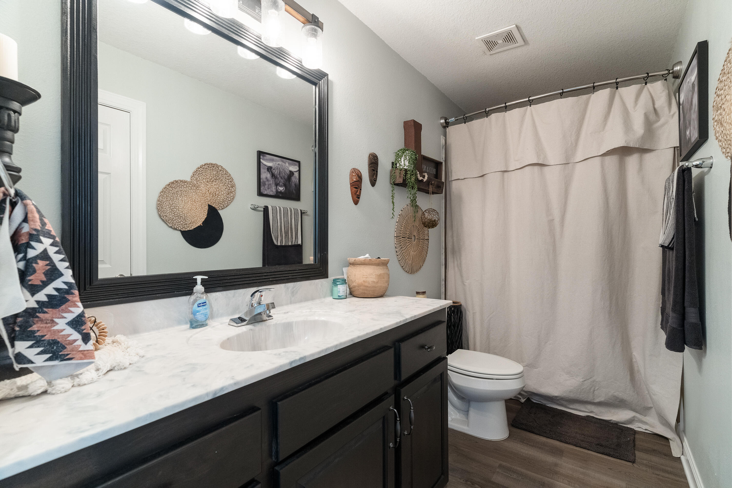 6263 Old River Road Baker, FL 32531 - Photo 57 of 69 a bathroom with a sink and a mirror