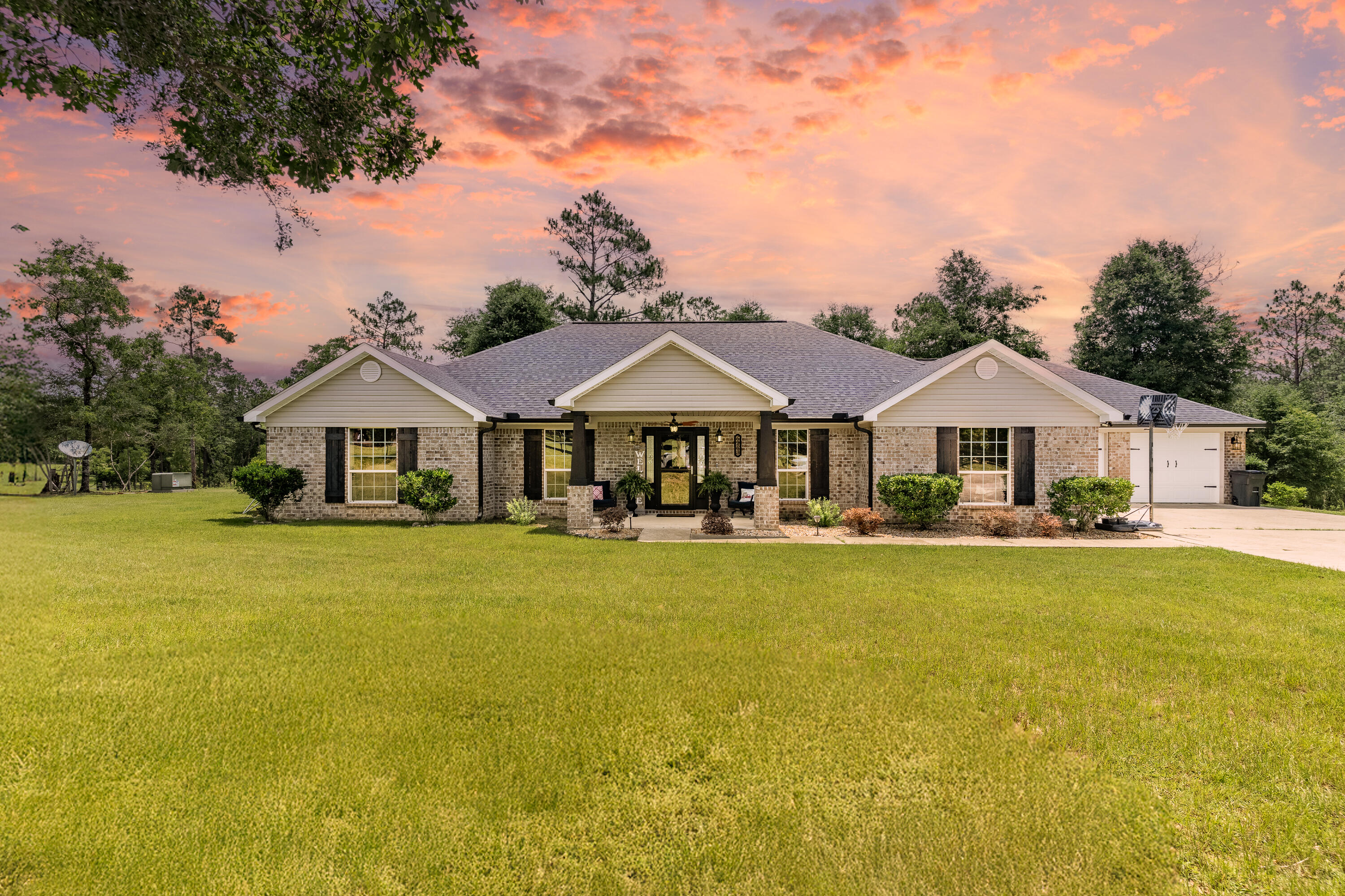 6263 Old River Road Baker, FL 32531 - Photo 66 of 69 a front view of a house with swimming pool
