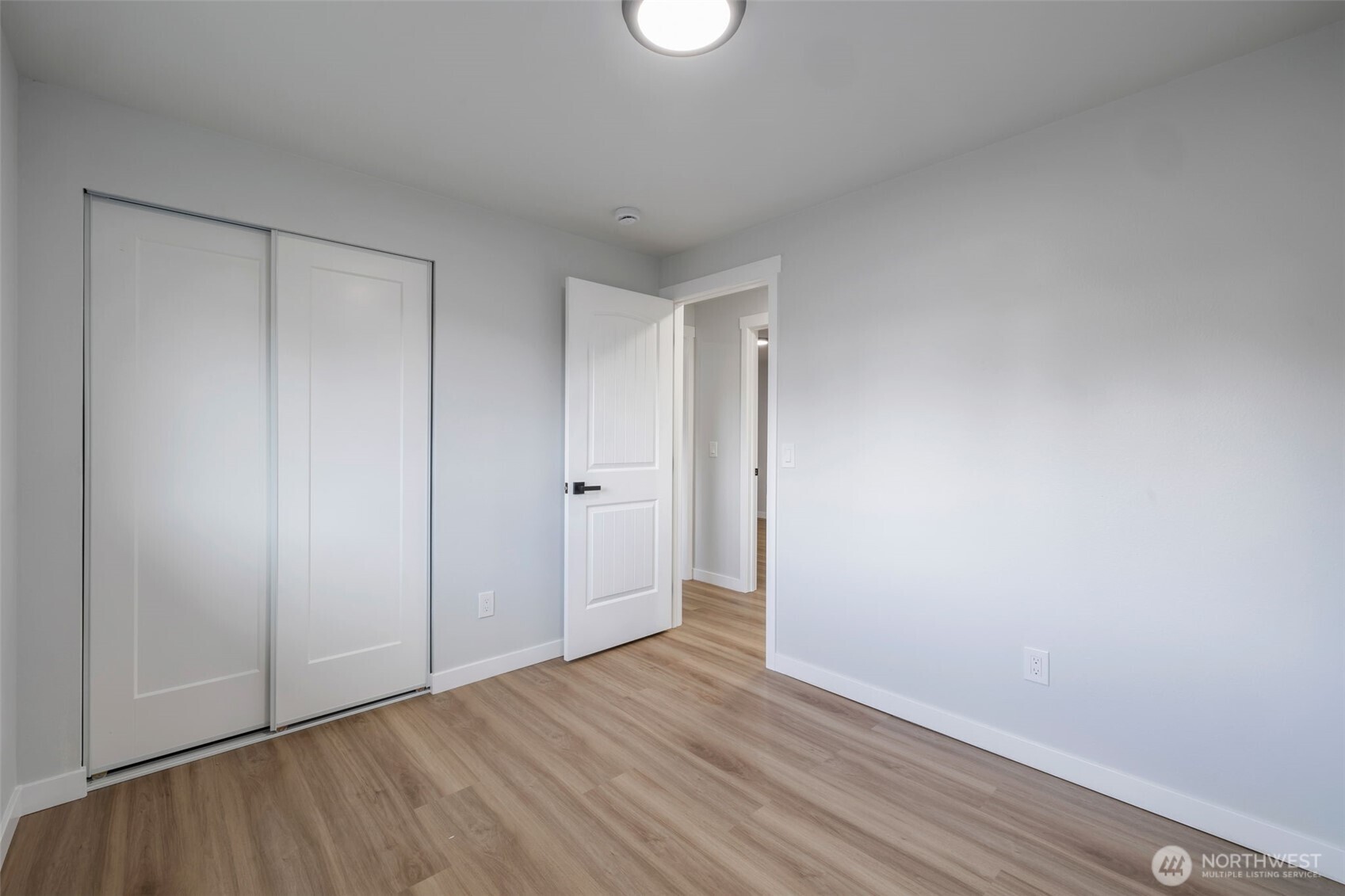 3611 Southwest 342nd Court Federal Way, WA 98023 - Photo 13 of 27 a view of an empty room and wooden floor