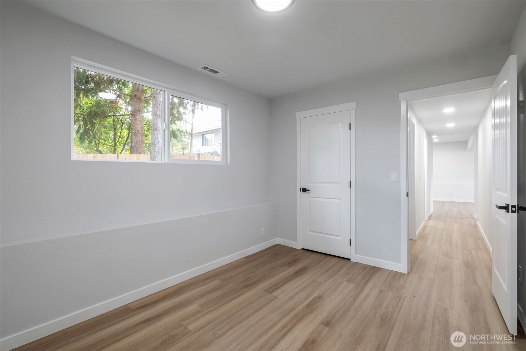 3611 Southwest 342nd Court Federal Way, WA 98023 - Photo 14 of 27 a view of a room with wooden floor and window