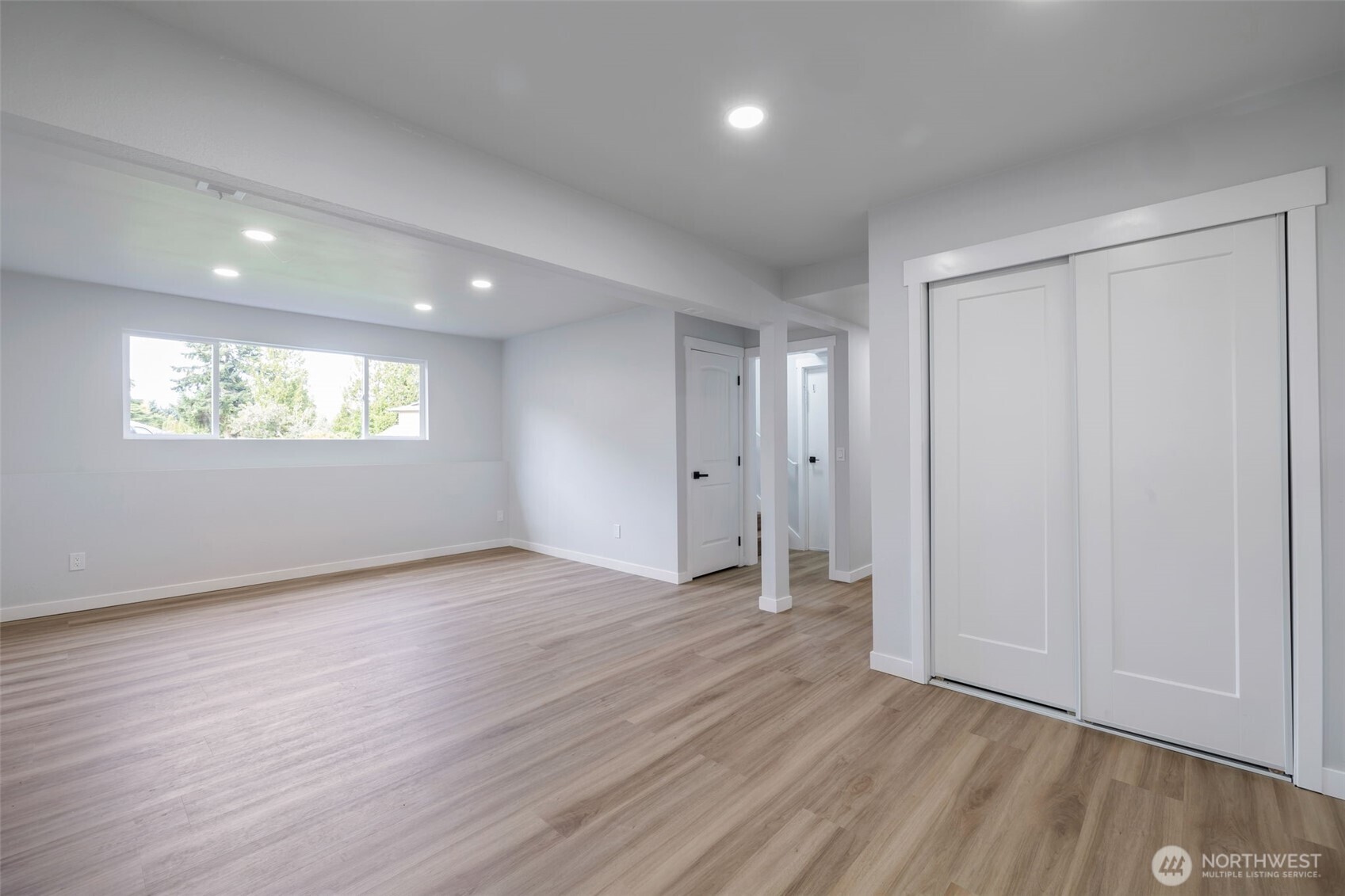 3611 Southwest 342nd Court Federal Way, WA 98023 - Photo 19 of 27 an empty room with wooden floor and windows