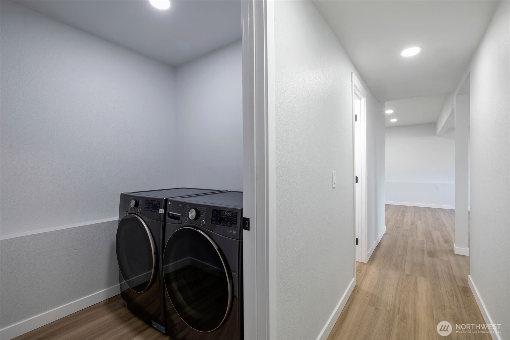 3611 Southwest 342nd Court Federal Way, WA 98023 - Photo 21 of 27 a view of a hallway with washer and dryer