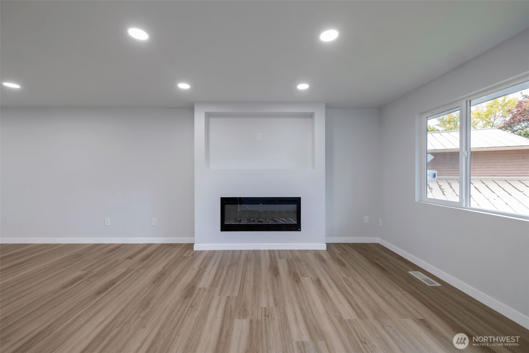 3611 Southwest 342nd Court Federal Way, WA 98023 - Photo 10 of 27 an empty room with wooden floor and windows