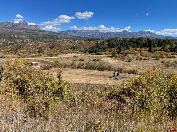 a view of a lake with sunset