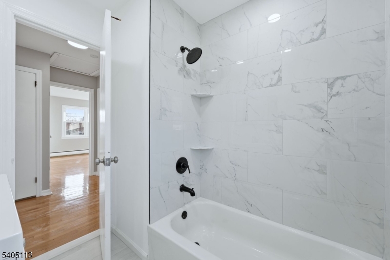 5 Josh Court Clifton, NJ 07011 - Photo 19 of 20 a bathroom with a bathtub