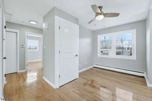 a view of livingroom with hardwood floor and ceiling fan
