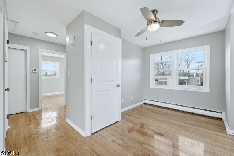 5 Josh Court Clifton, NJ 07011 - Photo 8 of 20 a view of livingroom with hardwood floor and ceiling fan