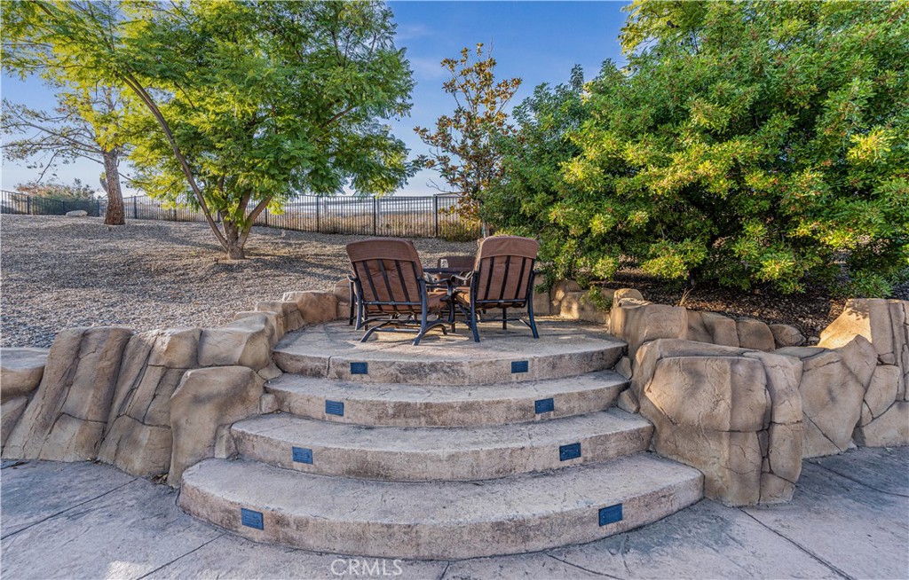 24195 Spencer Butte Drive Perris, CA 92570 - Photo 17 of 60 a view of a yard with furniture