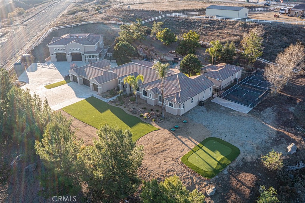 24195 Spencer Butte Drive Perris, CA 92570 - Photo 31 of 60 an aerial view of a house with a garden and lake view