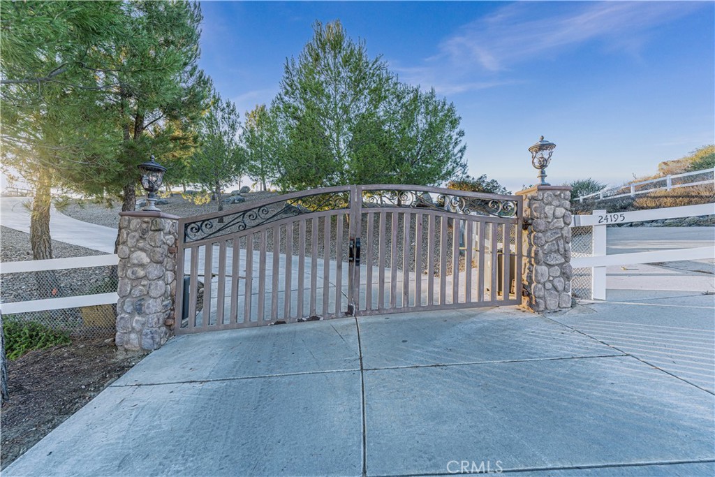 24195 Spencer Butte Drive Perris, CA 92570 - Photo 32 of 60 a view of a wrought iron fences in front of house