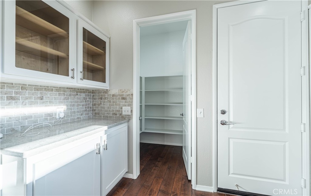 24195 Spencer Butte Drive Perris, CA 92570 - Photo 39 of 60 a view of walk in closet with empty racks