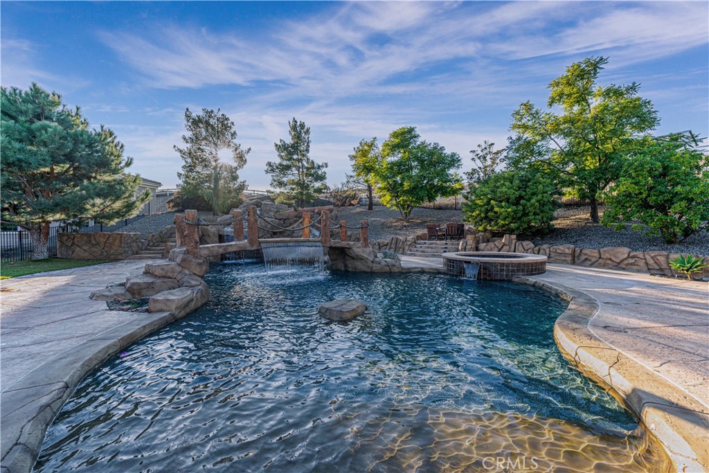 24195 Spencer Butte Drive Perris, CA 92570 - Photo 4 of 60 a backyard of a house with lots of green space