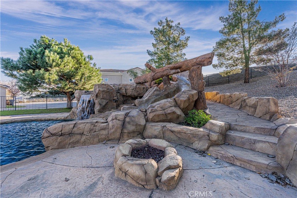24195 Spencer Butte Drive Perris, CA 92570 - Photo 5 of 60 a view of patio with couches and a fire pit