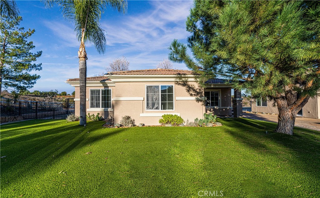 24195 Spencer Butte Drive Perris, CA 92570 - Photo 53 of 60 a view of a house with a backyard