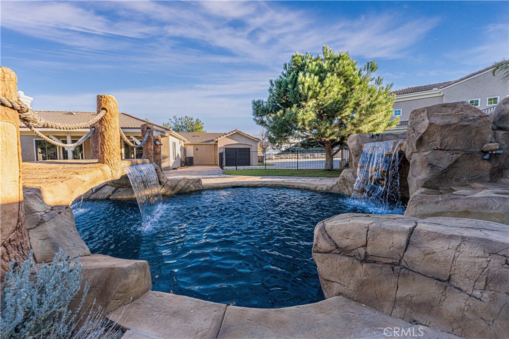 24195 Spencer Butte Drive Perris, CA 92570 - Photo 55 of 60 a view of a house with a yard