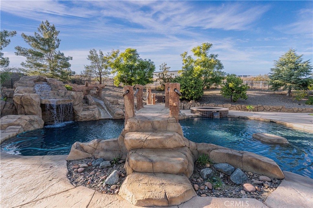 24195 Spencer Butte Drive Perris, CA 92570 - Photo 6 of 60 a view of a backyard with furniture and a garden