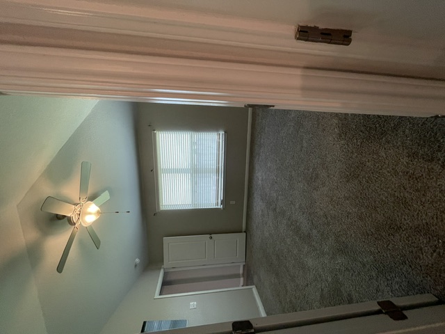 12401 Amber Lynn Path Manor, TX 78653 - Photo 17 of 33 Slanted ceilings and a ceiling fan create a comfortable ambiance.