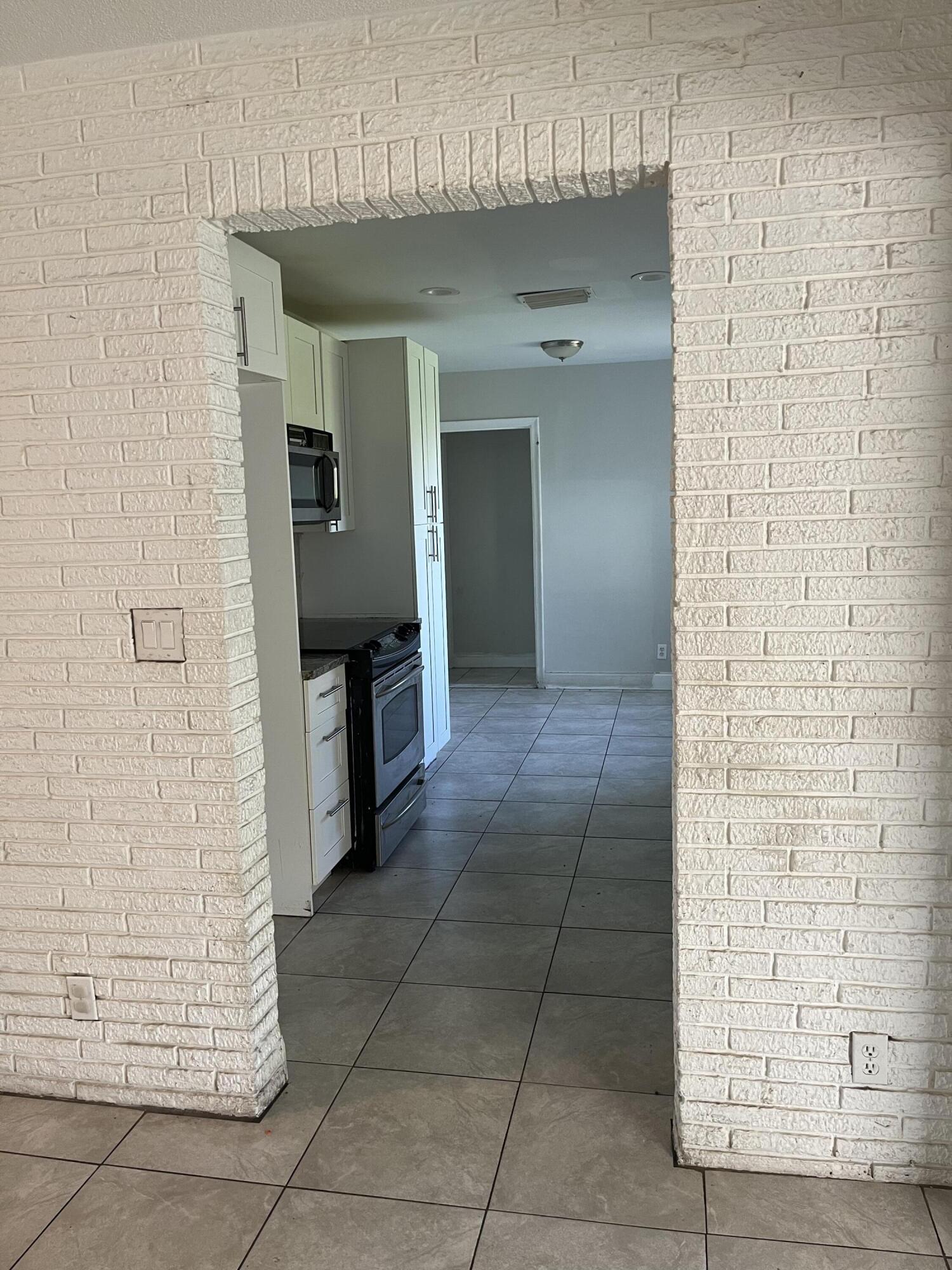 271 Southwest 4th Street Boca Raton, FL 33432 - Photo 4 of 4 a view of a hallway with seating area