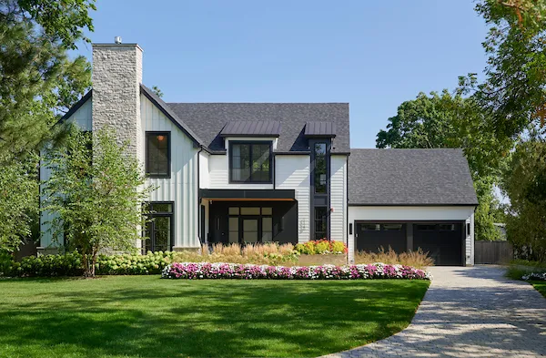 a front view of a house with a garden