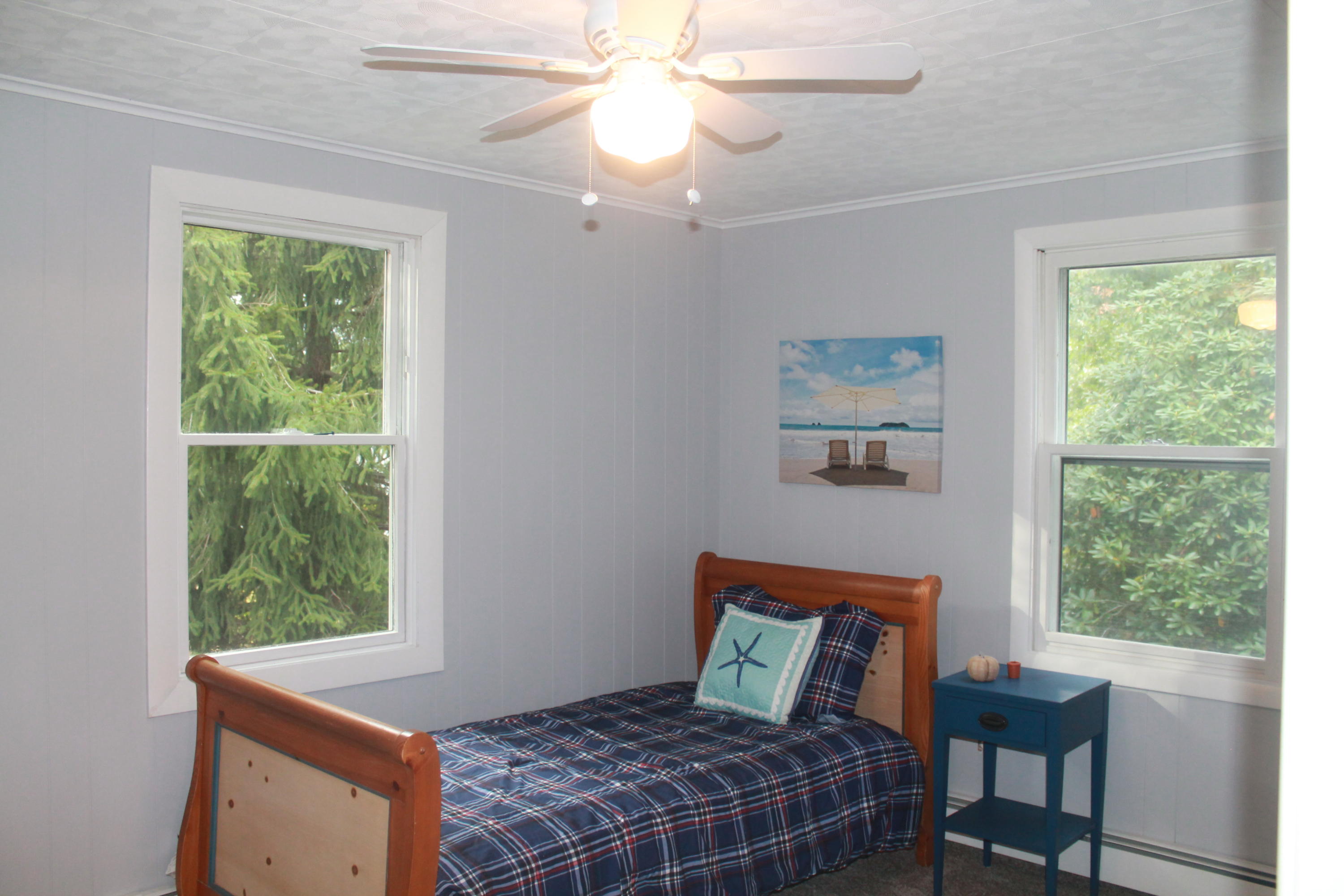 4 Frederick Road Falmouth, MA 02540 - Photo 12 of 27 a bedroom with a bed and a window