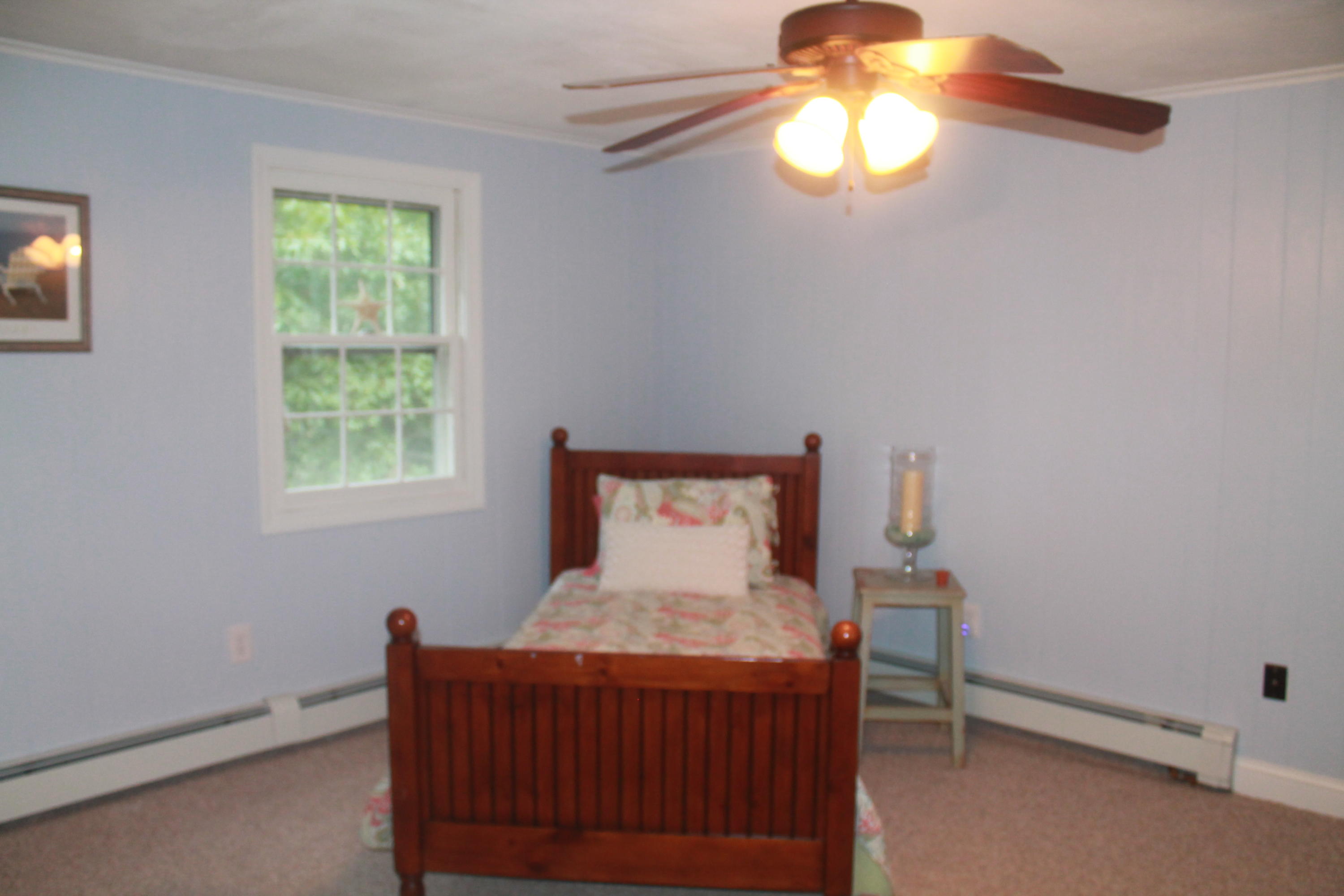 4 Frederick Road Falmouth, MA 02540 - Photo 14 of 27 a bedroom with a bed and a window