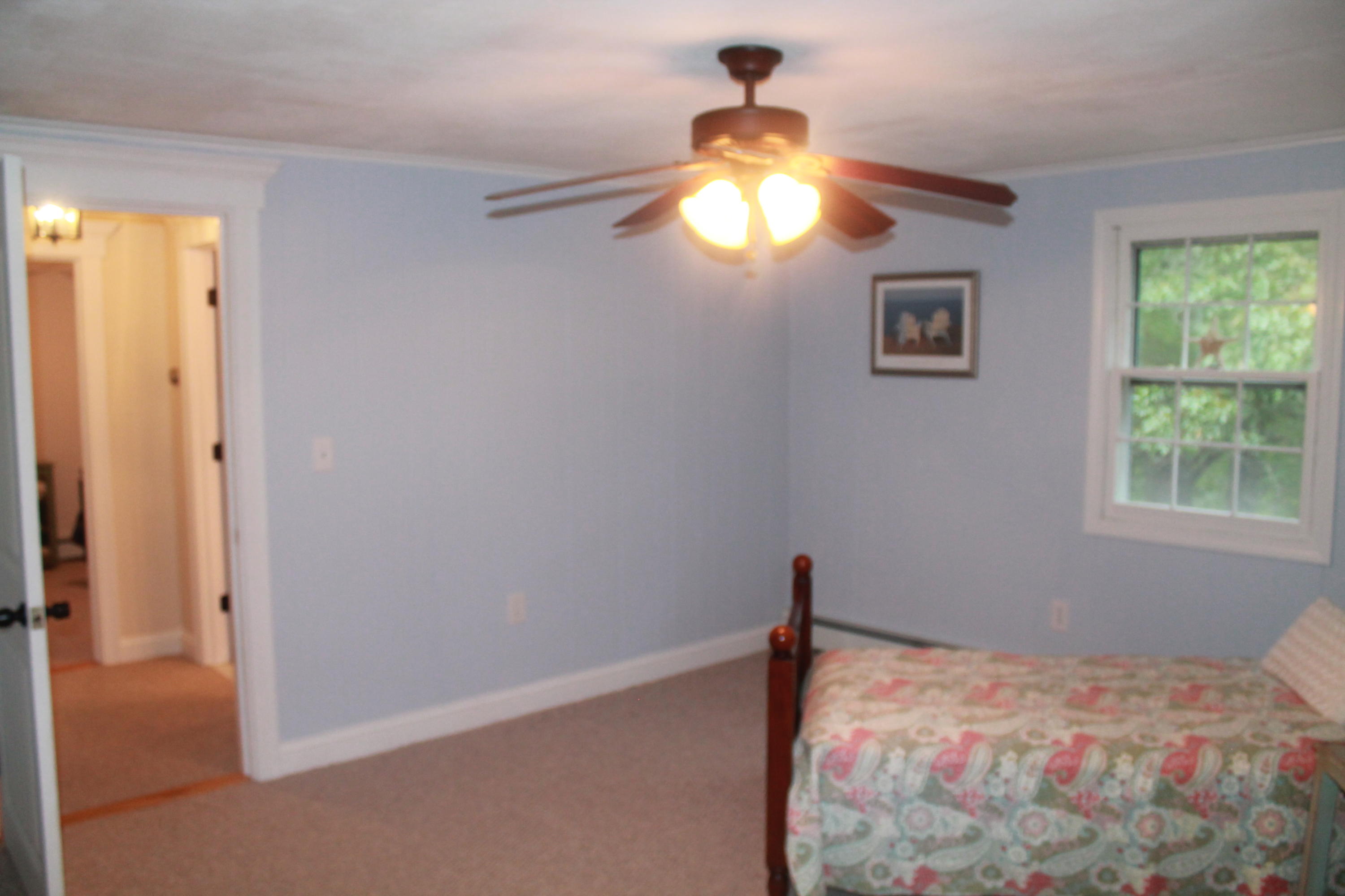 4 Frederick Road Falmouth, MA 02540 - Photo 15 of 27 a bedroom with a bed and a window