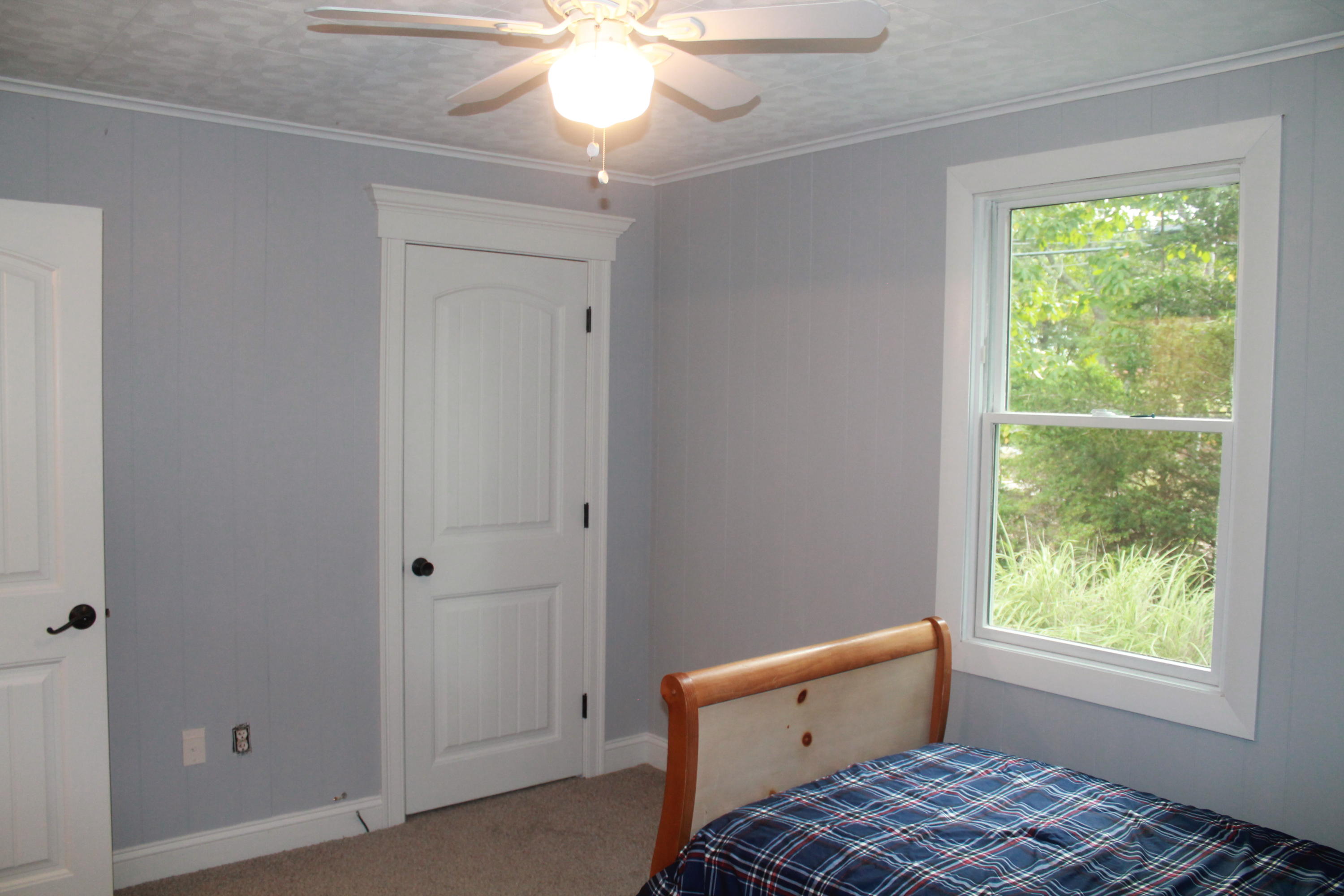 4 Frederick Road Falmouth, MA 02540 - Photo 17 of 27 a bedroom with a bed and a window
