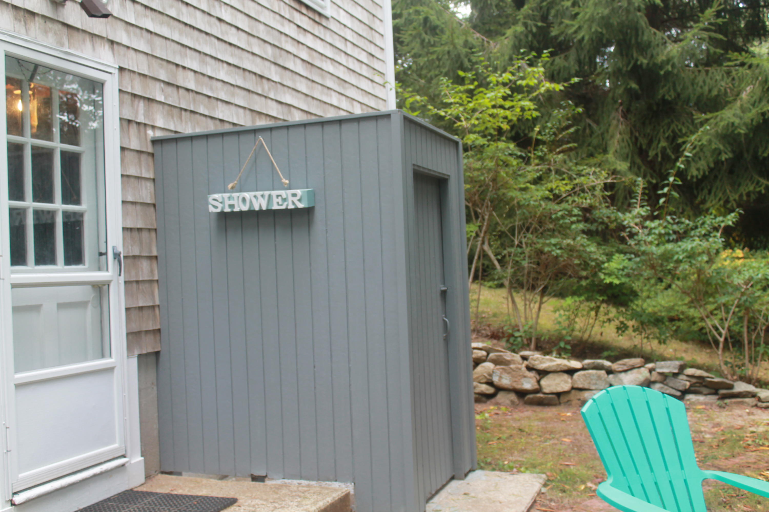 4 Frederick Road Falmouth, MA 02540 - Photo 24 of 27 a backyard of a house with outdoor seating