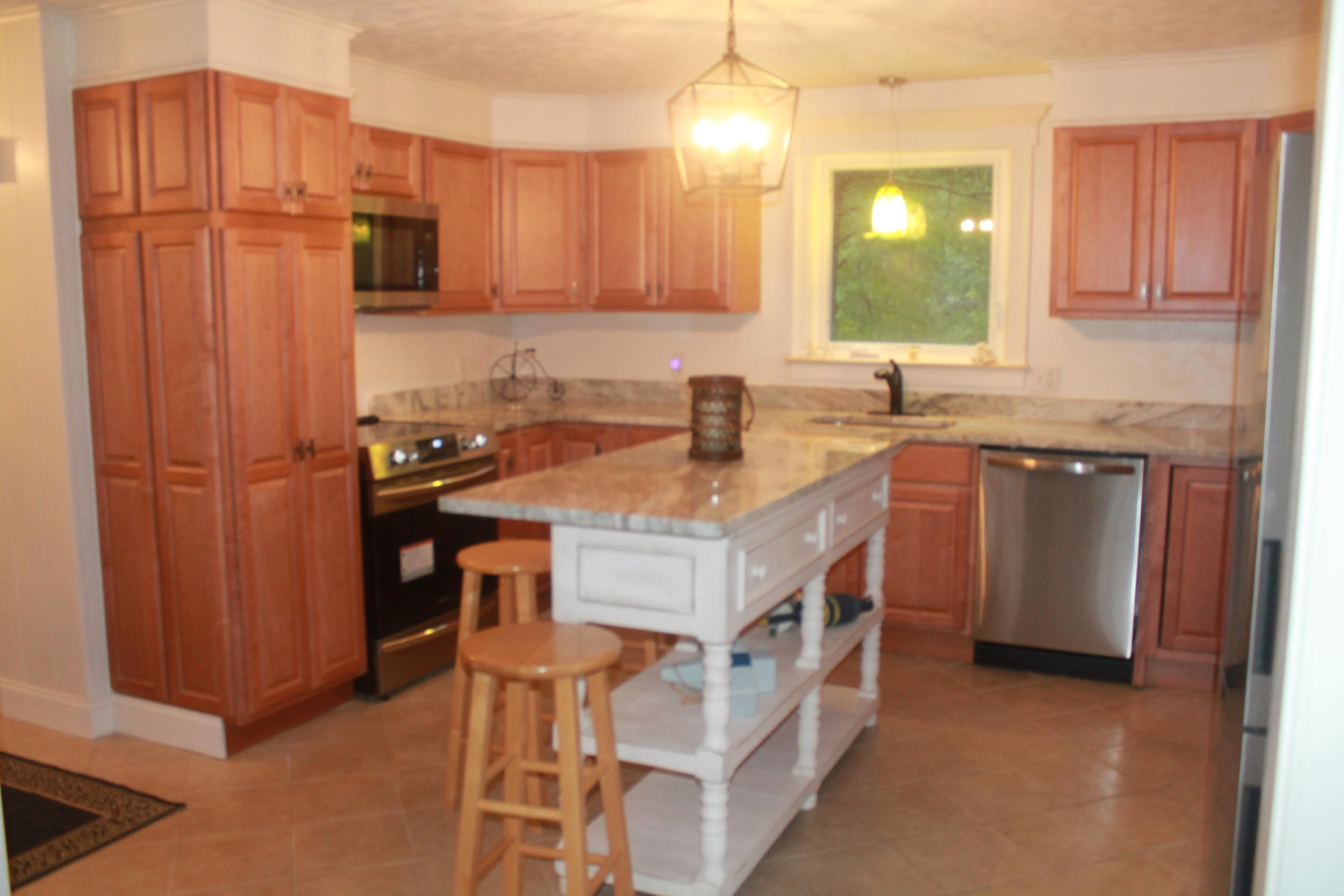 4 Frederick Road Falmouth, MA 02540 - Photo 5 of 27 a kitchen with stainless steel appliances granite countertop a sink a stove a refrigerator and island